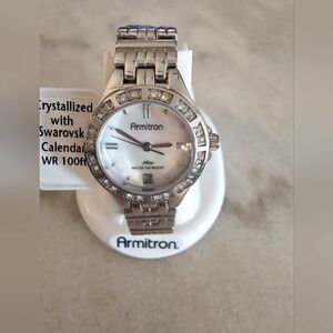 Woman's slim stainless steel watch, mother of pearl face